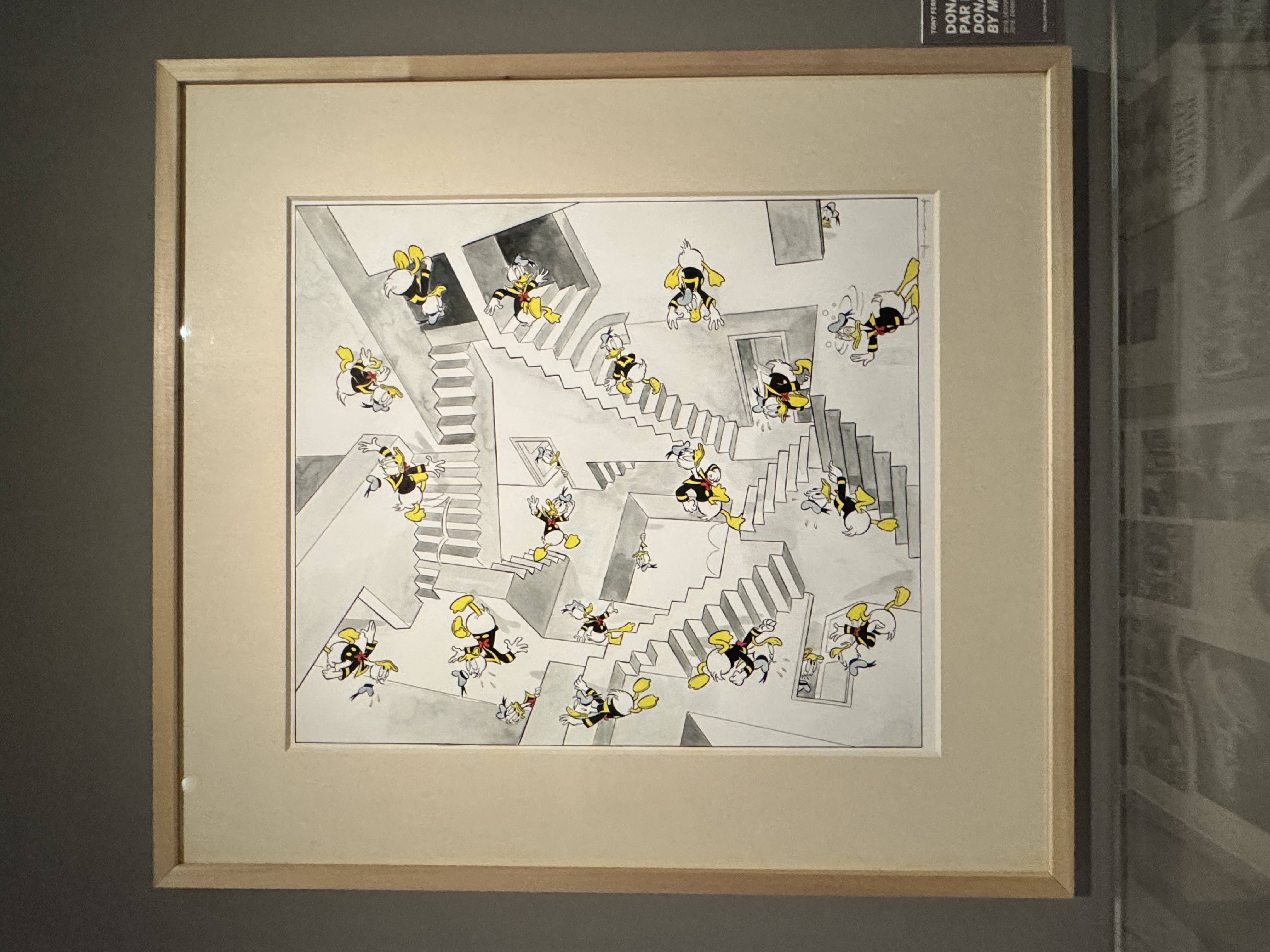 Dans cette oeuvre inspirée de Escher, on retrouve les escaliers de « Relativité » mais Donal remplace tous les personnages